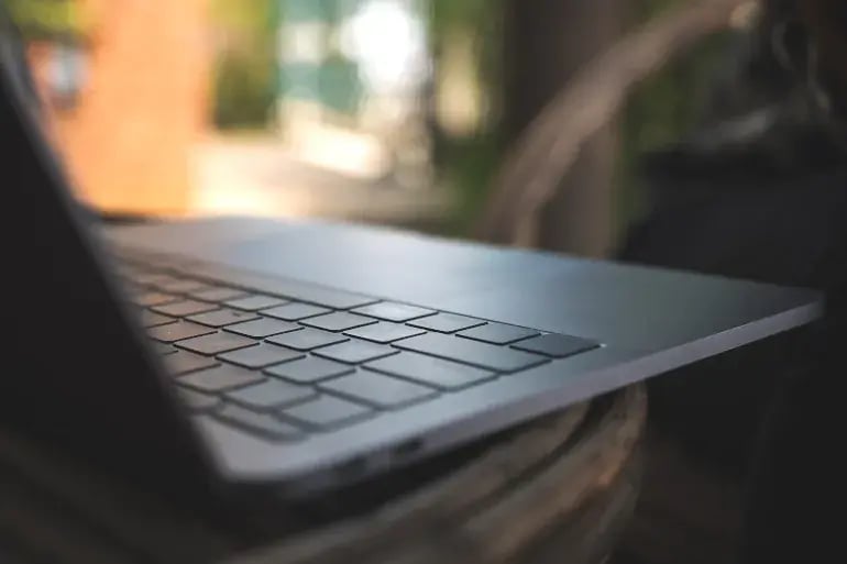 Laptop showing in a low lit background