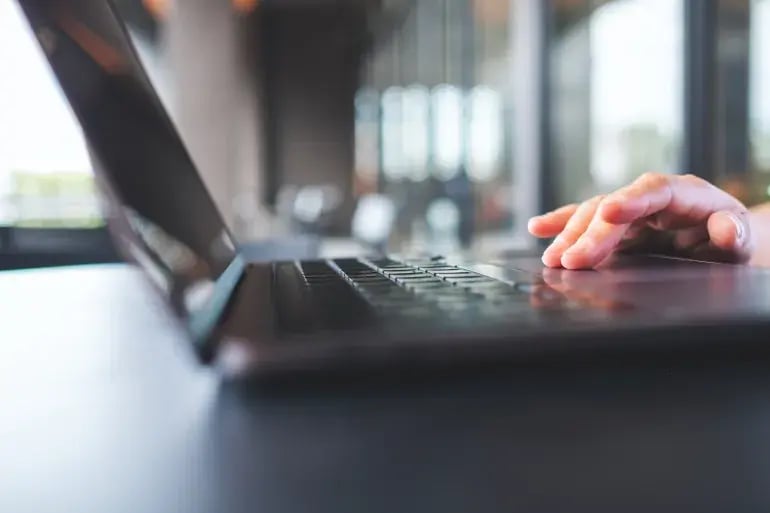 A person working hard on a a laptop 