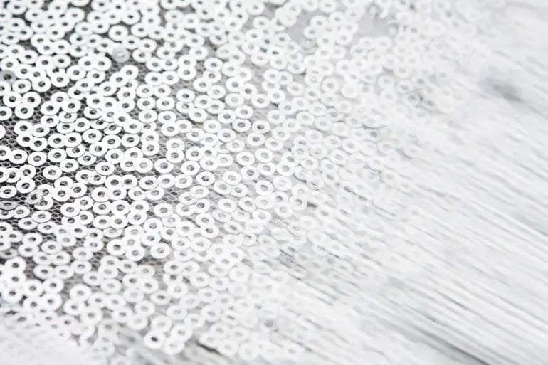 innovation-visual-revops-transformations-concept-abstract-fabric-texture-with-silver-rings