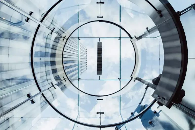 innovation-visual-revops-transformations-concept-abstract-low-angle-shot-of-a-circular-transparent-stairway