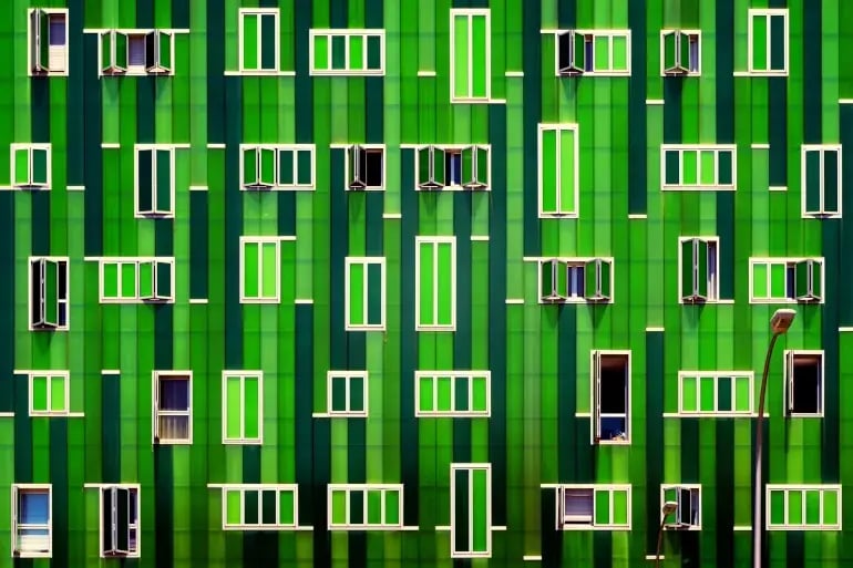 innovation-visual-revops-transformations-concept-bright-green-building-with-white-windows