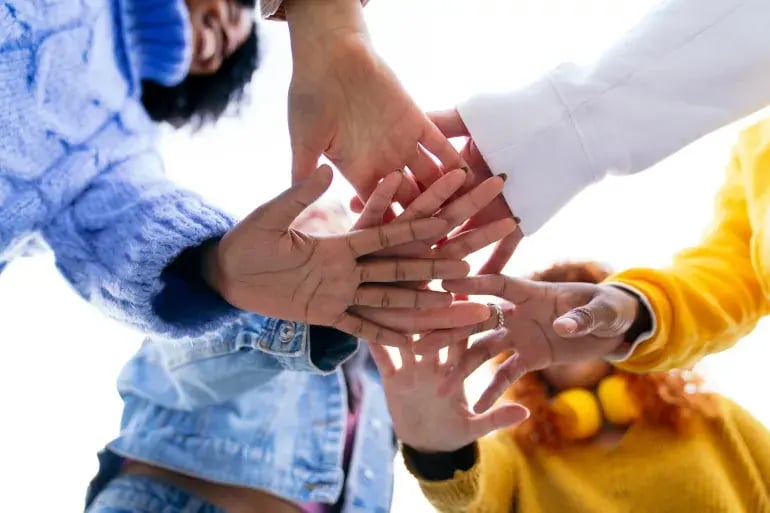 innovation-visual-revops-transformations-people-concept-people-joining-hands-together