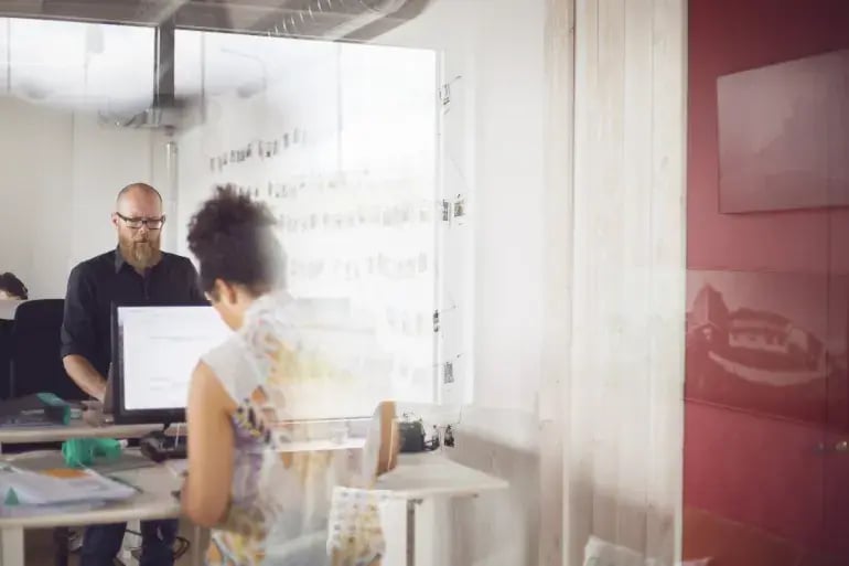 innovation-visual-revops-transformations-people-concept-two-colleagues-focused-on-their-work-in-office