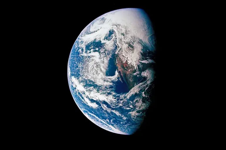 innovation-visual-revops-transformations-planet-earth-seen-from-space-half-covered-in-sun