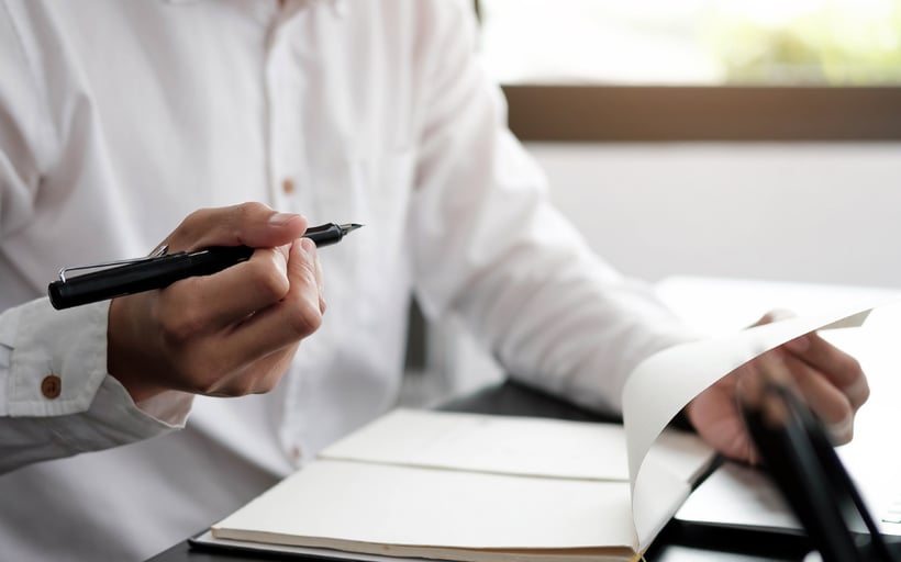 An individual writing out an AI policy