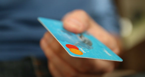 man holding credit card