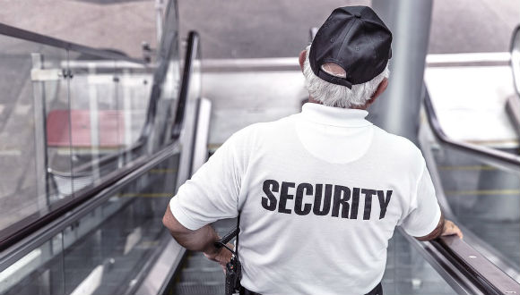 security guard on escalator