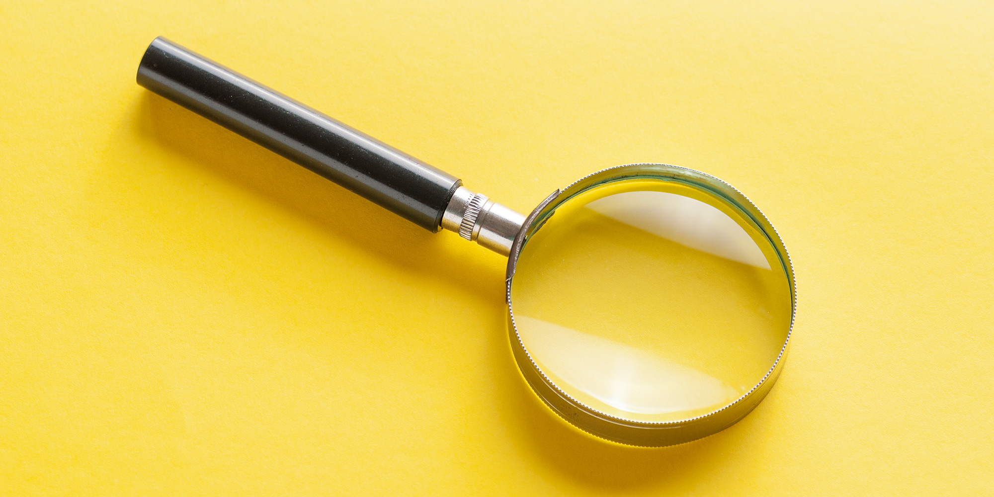 Magnifying Search Glass on yellow background