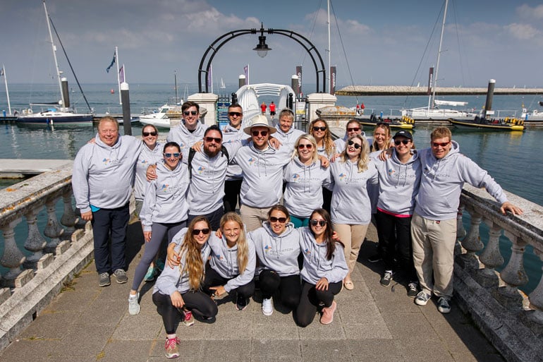 Innovation Visual Digital Marketing Team Photo in branded hoodies on Isle of White pier during sailing day