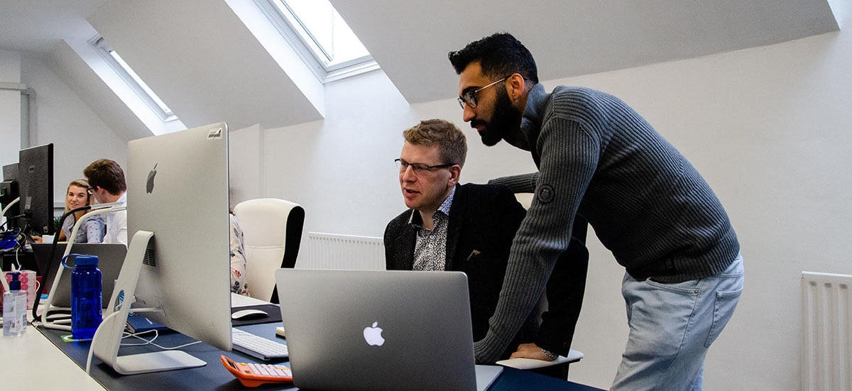 Innovation Visual team discussing website analytics 