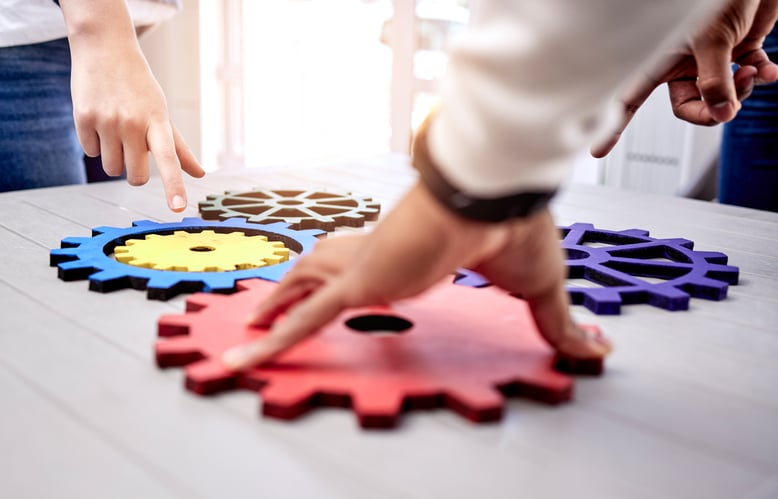 People at an organisation putting parts of a process together to create an automated version.