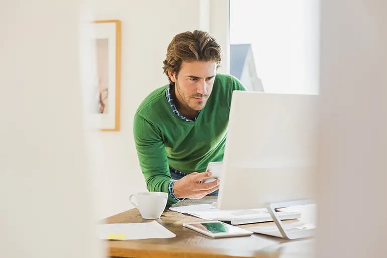 businessman choosing the right digital agency to call on computer