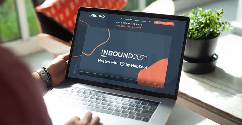 watching Hubspot Inbound 2021 event on laptop