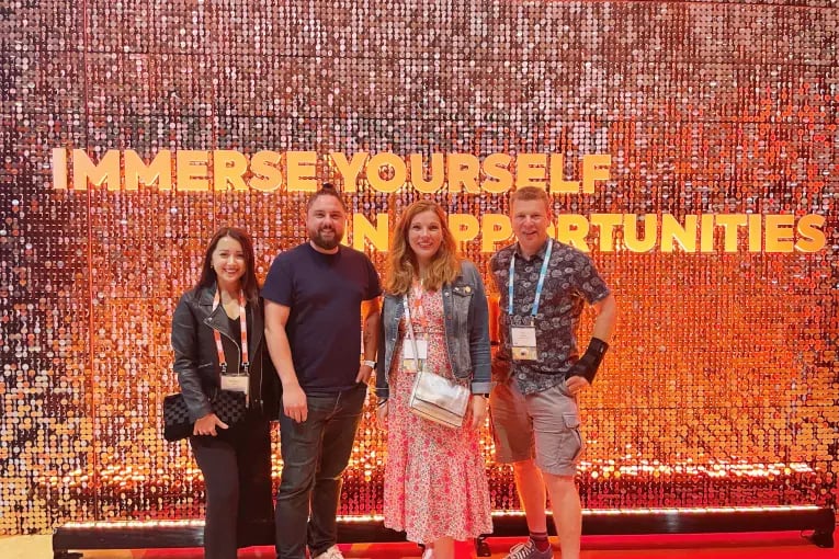 Innovation Visual Team at HubSpot Inbound 2022 in front of immerse yourself in opportunities wording