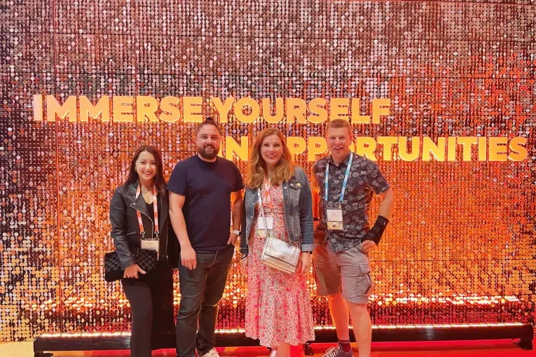 Innovation Visual Team at HubSpot Inbound 2022 in front of immerse yourself in opportunities wording