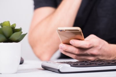 man searching on mobile device