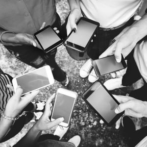 young-adults-using-smartphones-in-a-circle-social