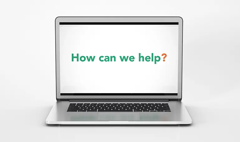 Laptop screen with how can we help text from digital agency