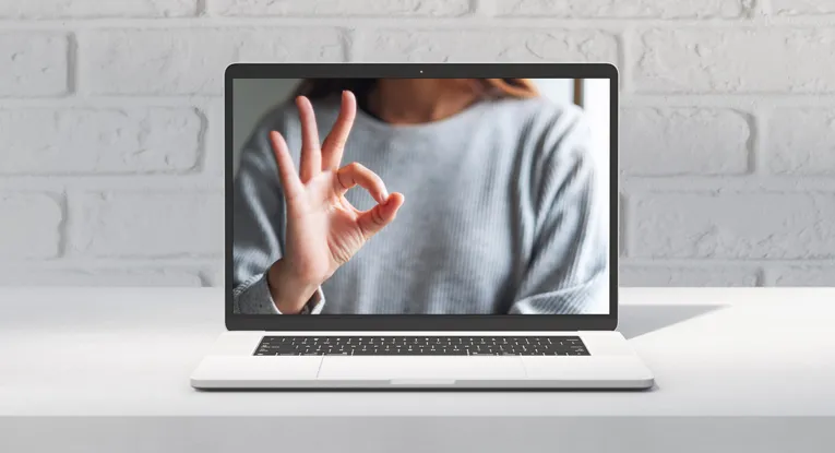 hand making ok sign clear helpful content concept on laptop screen